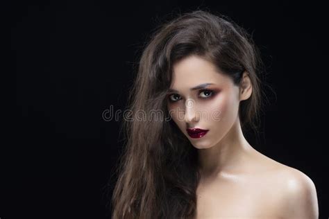 Portrait Of A Beautiful Glamorous Brunette Girl With Naked Shoulders Shimmering Makeup Red