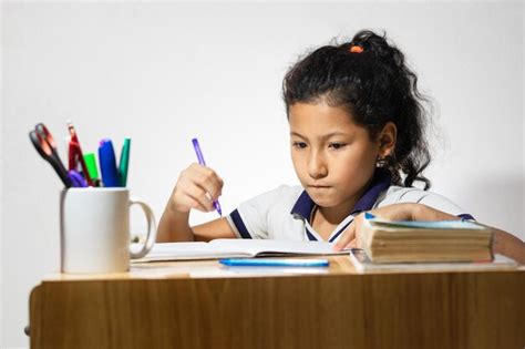 Premium Photo Latina Brunette Girl Studying At Her Desk With An