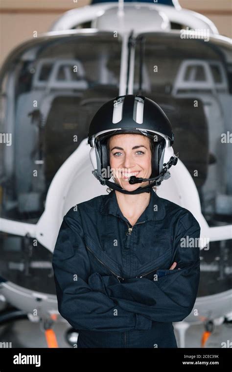 Portrait attractive Woman helicopter pilot In the hangar Stock Photo ...