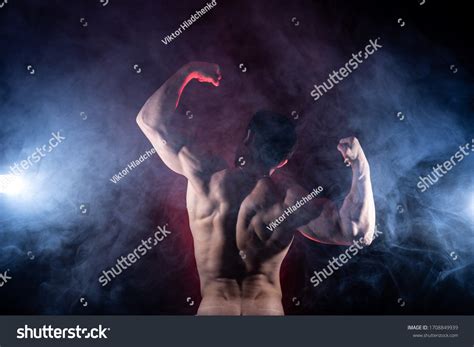 Muscular Man Showing Muscles On Black Stock Photo 1708849939 Shutterstock