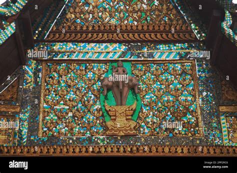 stucco gable depicts indra riding  erawan elephant  vine