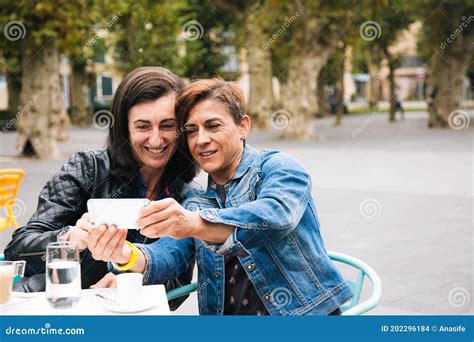Middle Aged Lesbian Couple Taking A Selfie Stock Photo Image Of Mobile Phone