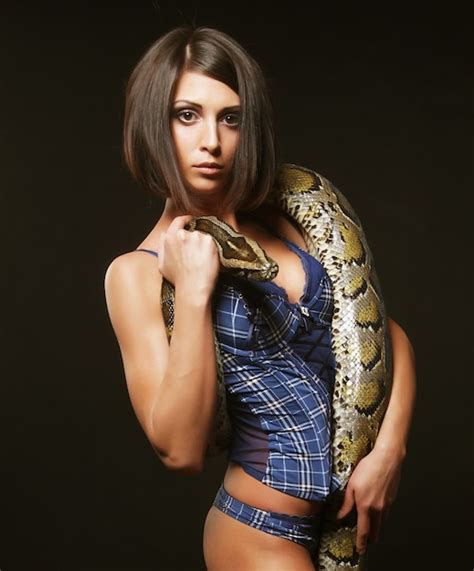 Premium Photo Sexy Brunette Holding Python