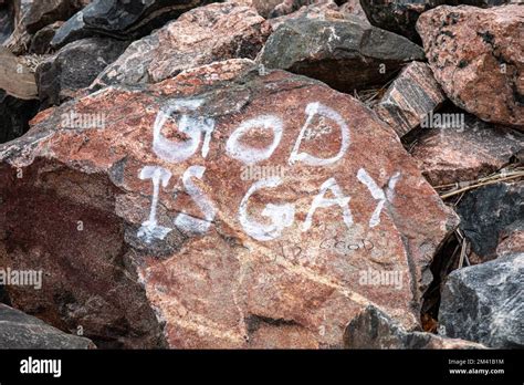 God Is Gay Graffiti On Hietaniemi Beach Rock In Helsinki Finland Stock Photo Alamy