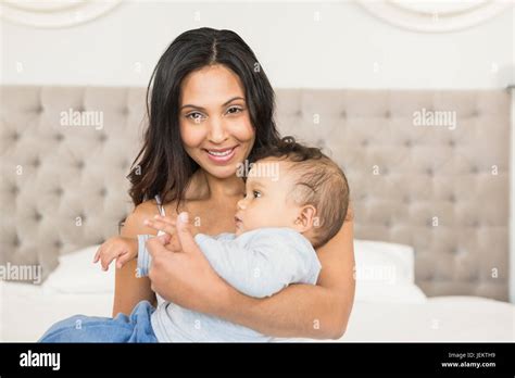 Happy Brunette Holding Her Baby Stock Photo Alamy