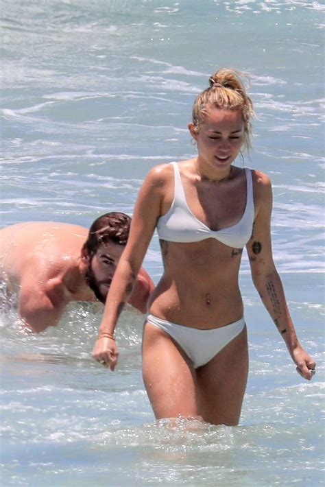 Miley Cyrus Hits The Ocean In A White Bikini With Liam Hemsworth In