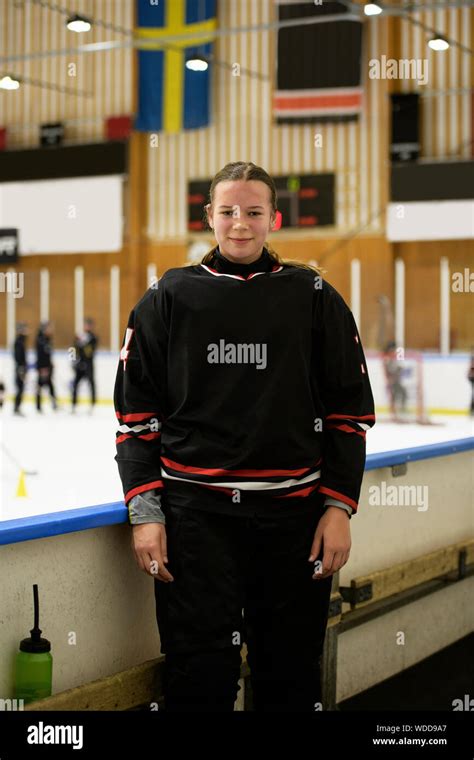 Girl in ice hockey uniform during training Stock Photo - Alamy