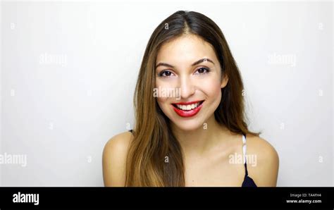 Portrait Of Young Beautiful Shy Girl Smiling Looking At Camera Over