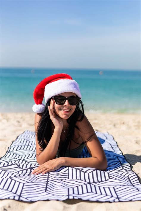 Christmas Beach Woman Wearing Santa Hat And Bikini Enjoying Winter
