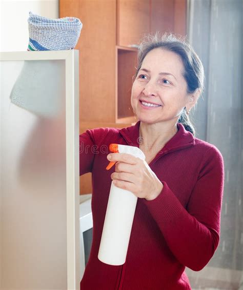 Happy Mature Girl Cleans Glass Stock Image Image Of Housework Cleanup