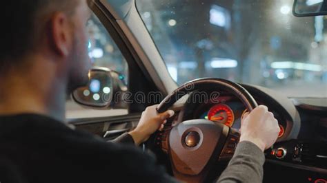 Man Driving Car Through The Streets Of Night City Stock Video Video