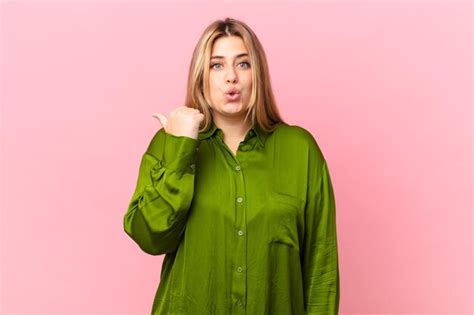 Premium Photo Curvy Pretty Blonde Woman Looking Astonished In Disbelief
