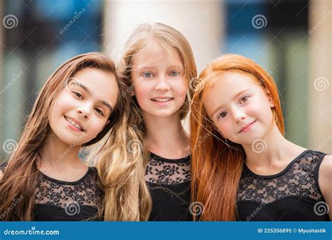 Portrait Of Three Teenage Girls With Loose Hair Blonde Redhead And