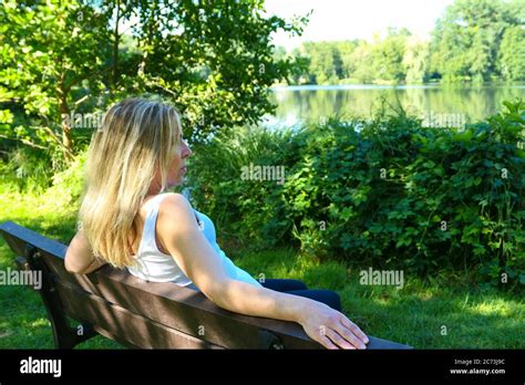 Blonde Girl On Park Bench High Resolution Stock Photography And Images Alamy