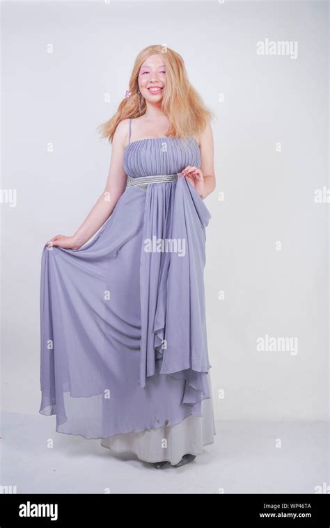 Cute Fashion Lady With Asian Face And Blonde Hair In Gray Dress Stock
