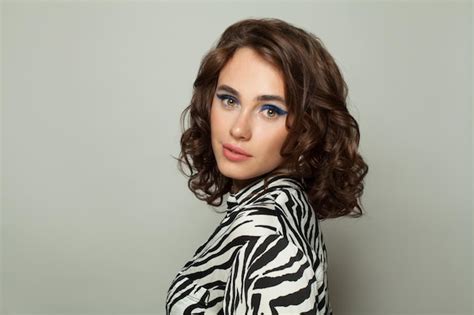 Premium Photo Pretty Woman Brunette In Black And White Zebra Print Blouse