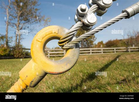 Yellow Guy Wire For Steel Cable Two Steel Cables Are Looped Through