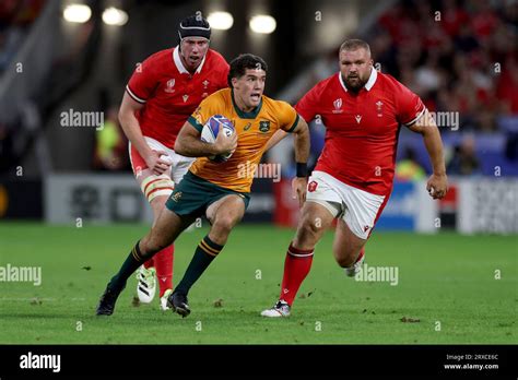 Australias Ben Donaldson Centre Breaks Away From Wales Adam Beard