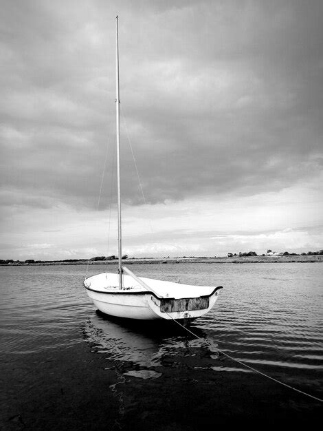 Premium Photo Sailboat Moored On Sea Against Sky