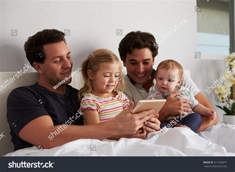 Male Gay Parents Using Tablet Computer Stock Photo Edit Now