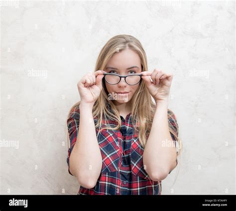 Deep Sight Of The Attractive Blonde Head Woman Wearing Glasses Looking At Camera Indoor Stock