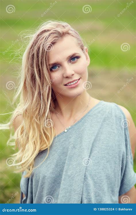 Outdoor Portrait Of A Beautiful Middle Aged Blonde Woman Picture Image