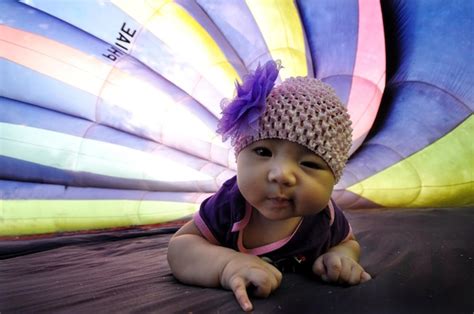 Premium Photo Close Up Of Cute Baby Girl In Hot Air Balloon