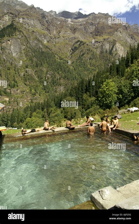 Many Men Bathing In Khirganga Hot Springs Pool Pond Parvati Valley India Himalaya Stock Photo