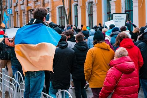 Premium Photo Man Wrapped In Ukrainian Blue And Yellow Flag Walking