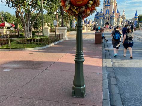 PHOTOS Main Street U S A Lampposts Begin To Receive Gold Accents For