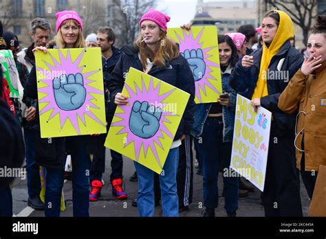 Women Wearing Pink Pussy Hats With Protest Signs With A Pink Closed Fist My Body My Choice