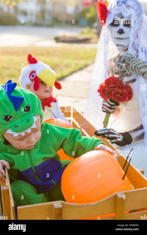 Trick or treating in costumes on Halloween night Stock Photo - Alamy