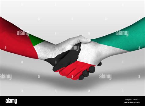 Handshake Between Kuwait And United Arab Emirates Flags Painted On