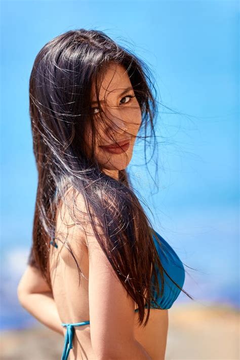 Close Up Portrait Of Beautiful Asian Girl In A Blue Bikini Posing On A Beach Stock Photo Image