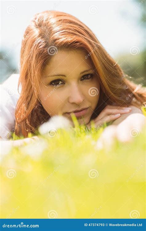 Portrait Of A Pretty Redhead Calm And Lying Stock Image Image Of