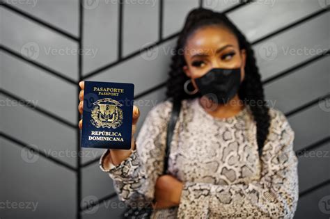 African american woman wearing black face mask show Dominican Republic