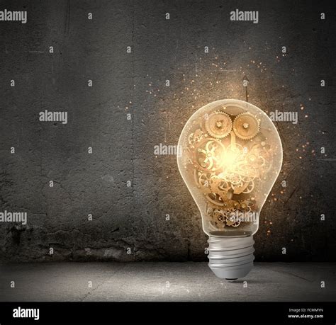 Close Up Of Light Bulb And Gears Mechanism Stock Photo Alamy