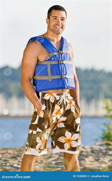 Man Wearing Life Jacket At Beach Stock Photos Image 7430803