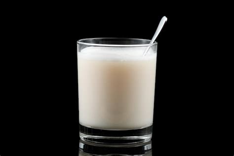 Premium Photo A Glass Of Protein On A Black Background