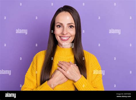 Photo Of Good Brunette Mature Lady Hands Heart Wear Yellow Pullover Isolated On Violet Color