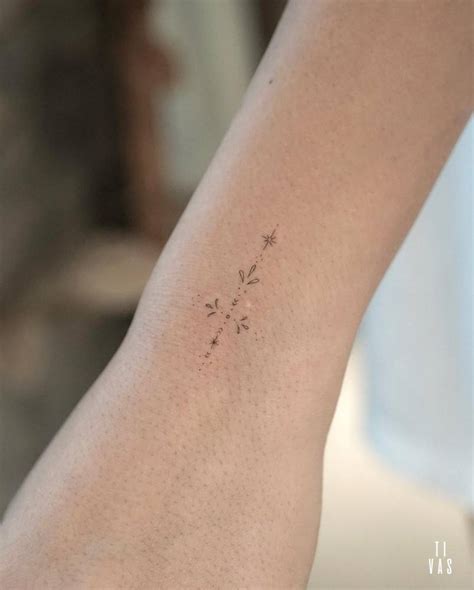 Fine Line Style Ornament Tattooed On The Wrist