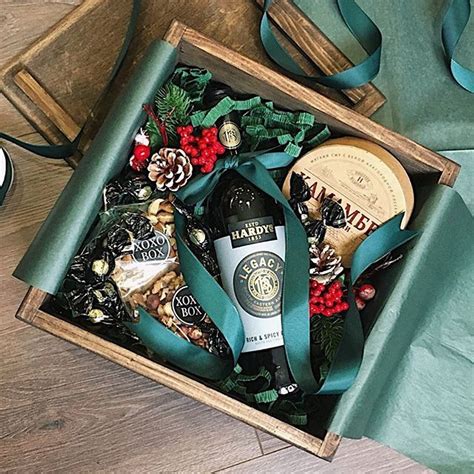 a wooden box filled with bottles of alcohol and christmas decorations ...