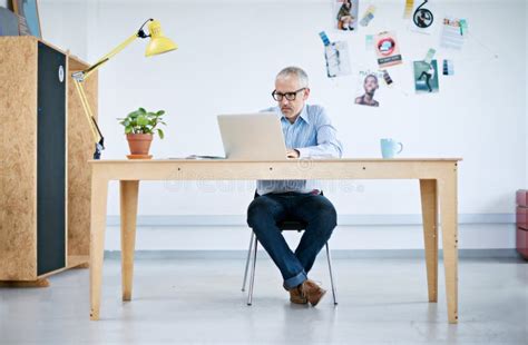 Mature Business And Man With Laptop In Office For Research Information And Writing Document