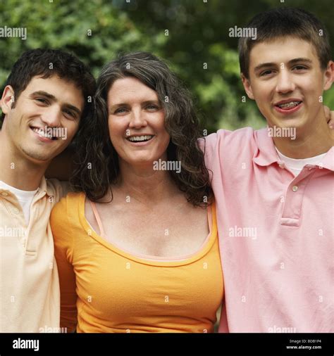 Portrait Of A Mature Woman Smiling With Her Sons Stock Photo Alamy