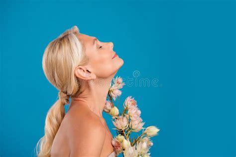 Photo Of Shiny Dreamy Elderly Lady Naked Shoulders Closed Eyes Flowers