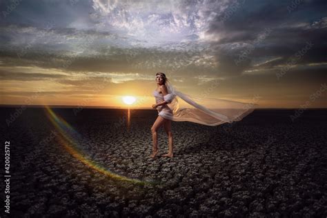 Beautiful Blonde Woman Is Posing In Maxi Yellow Dress On Desert With Naked Sexy Legs Summer