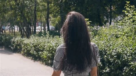 Backside View Long Haired Brunette Girl Stock Video Pond