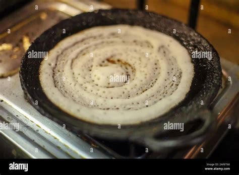 Dosa Indian food. women cooking or making of Dosa in kitchen, India ...