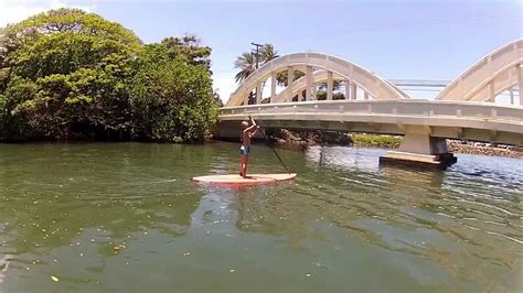 Paddeling The Anahulu Stream Under The Rainbow Bridge In Haleiwa