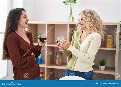 Two Women Mother And Daughter Drinking Wine At Home Stock Photo Image